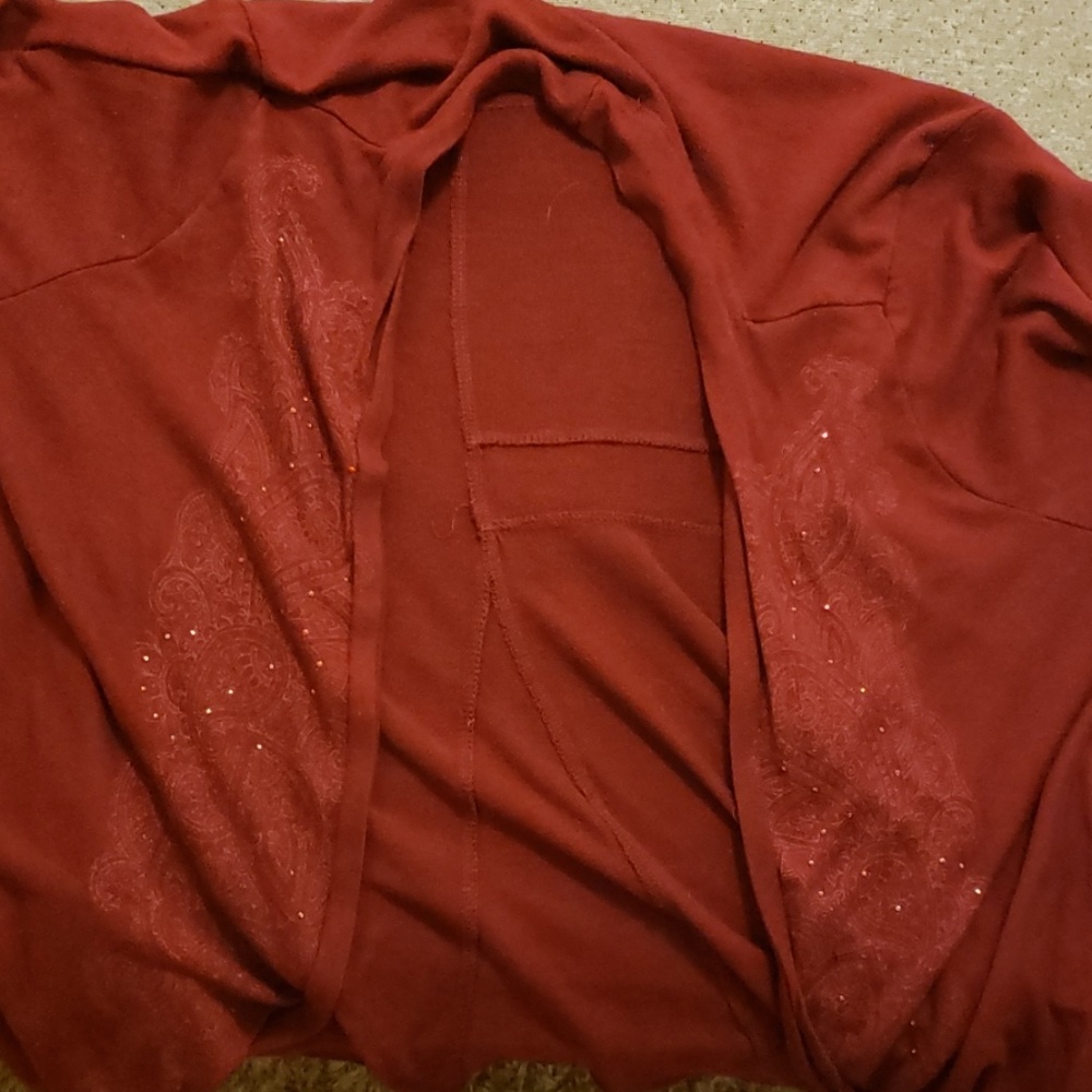 A maroon colored cardigan